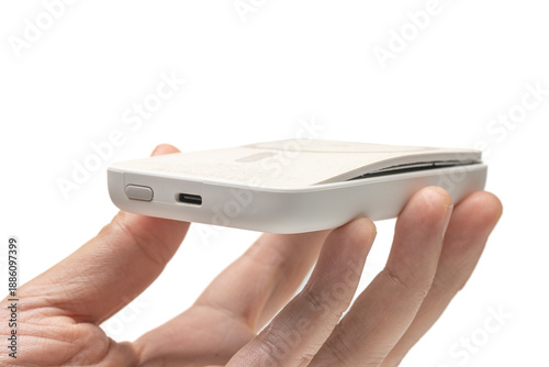 hand holding swollen powerbank or battery pack. isolated on white background.
