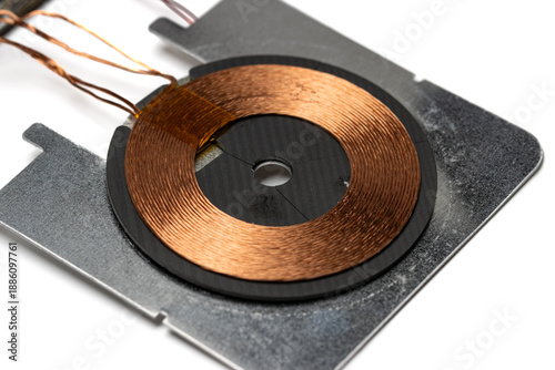 close up view of copper coil of wireless charging module. usually found in wireless charger or wireless charging capable device.