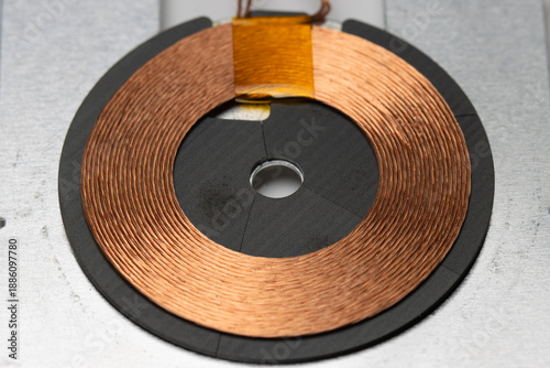 close up view of copper coil of wireless charging module. usually found in wireless charger or wireless charging capable device.