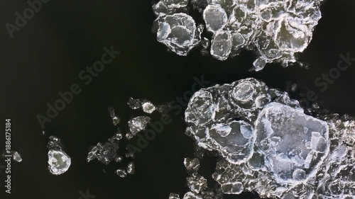 Aerial ice Vistula River winter Poland climb fast 4K. Winter season cold arctic temperatures form ice flows dangerous ice jams block and damage waterway. Beautiful shore with ice bergs floating.