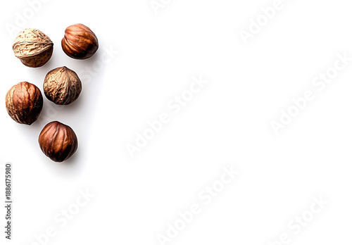 Wallpaper Mural Hazelnuts with shells arranged on white background, showcasing their natural texture and color, perfect for culinary or decorative use Torontodigital.ca