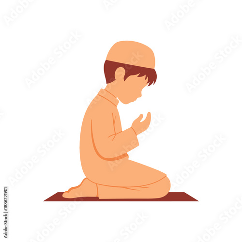 Young Muslim boy praying on a prayer mat, kneeling with hands raised.