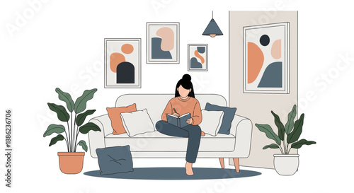 Woman reading a book on a comfortable sofa at home.