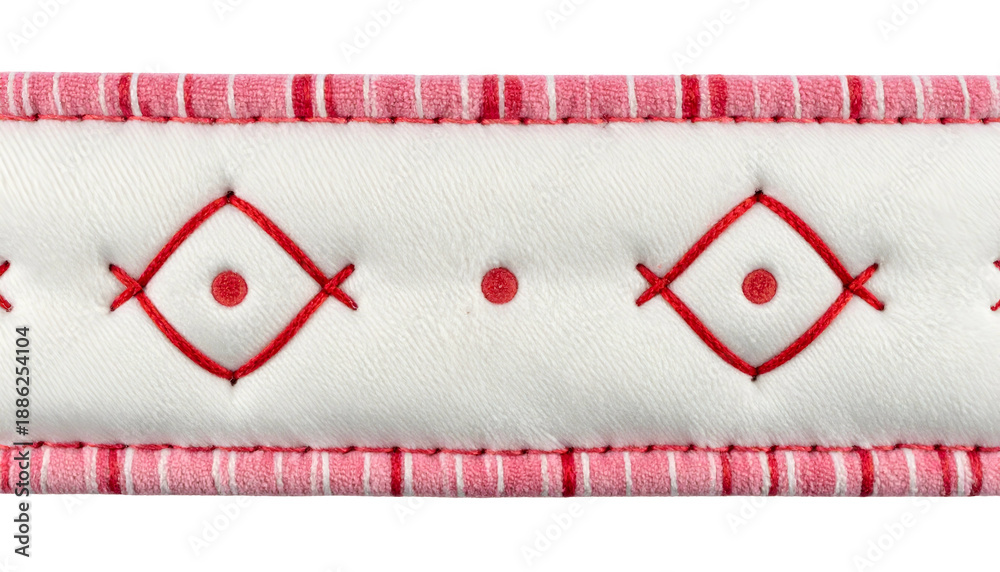 Naklejka premium Close-up of a padded, white surface with red stitched diamond pattern and striped border