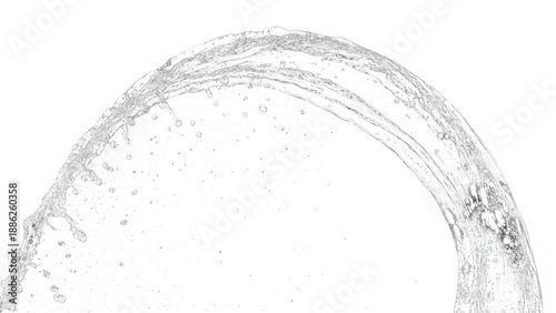 A stream of water arches through the air against a black background