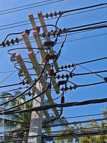 High voltage underground cable termination on concrete riser pole prepared for cable lug connection to power distribution grid infrastructure.