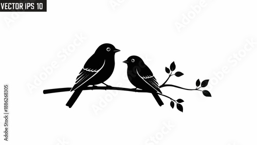 Two small birds perched on a tree branch silhouette.