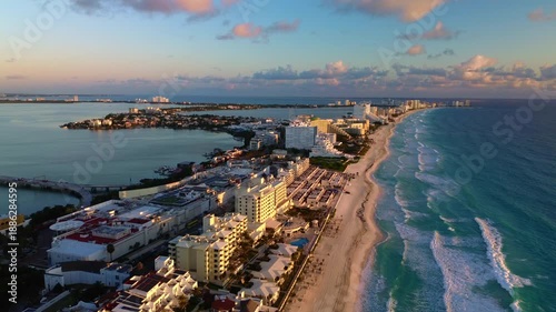 Breathtaking Aerial View of Turquoise Ocean Waves Crashing Along the Pristine Sandy Beaches of Cancun Hotel Zone, Mexico in a Vibrant Summer Paradise