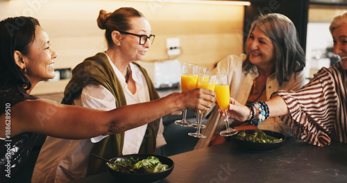 Принти на полотні Drink, smile and toast with senior women in kitchen of home together for bonding or reunion