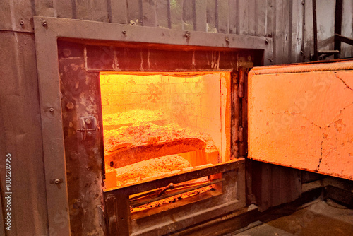 Photos Glowing industrial furnace with open combustion chamber, revealing extreme heat