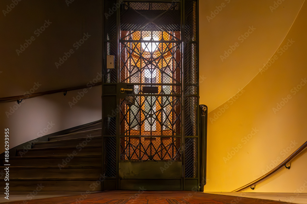 Fototapeta premium Stockholm, Sweden A classic old elevator shaft in a residential building stairwell.