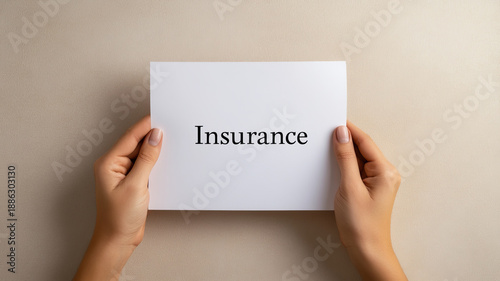 Wallpaper Mural Hands holding paper insurance concept, neutral background, safety and protection idea Torontodigital.ca