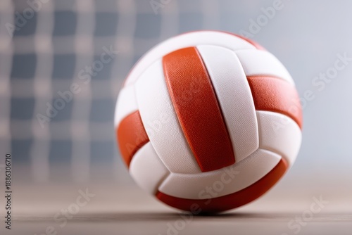 Volleyball Net Strategy concept. Volleyball resting on the floor with a net in the background.