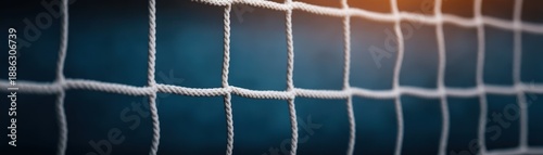 Volleyball Net Strategy concept. Close-up of a tennis net against a dark background.