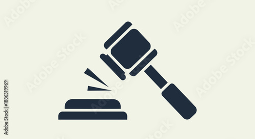 Symbol of justice and legal decision with a gavel striking a block