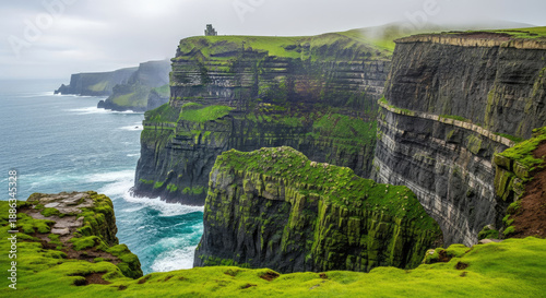 A breathtaking landscape of the Cliffs of Moher with lush green grass and rugged rock formations overlooking the vast ocean