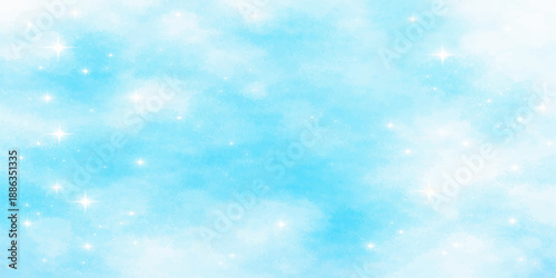 A beautiful blue abstract Christmas background features a bright sun shining through white clouds in a clear summer sky atmosphere to create a heavenly high view of nature and light