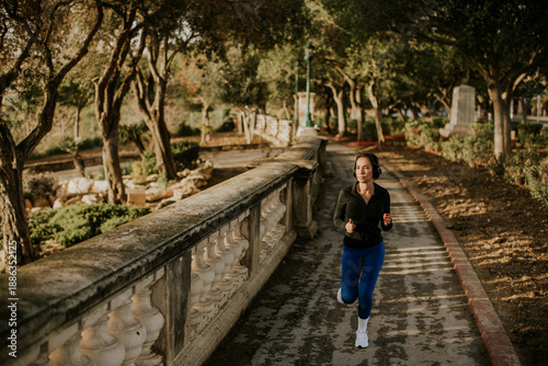 Woman jogging on path in Ma...