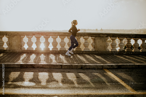 Woman runs along the coast ...