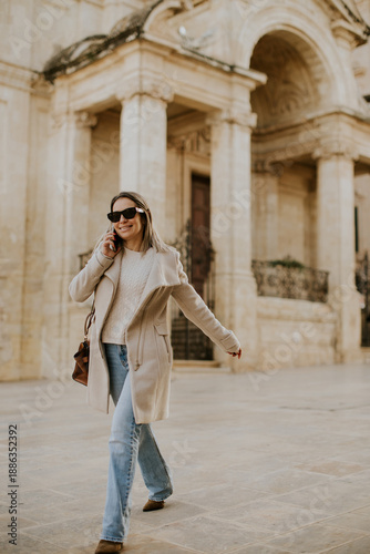 Woman walks and talks in Ma...