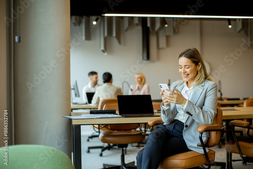 Woman engaging with smartph...