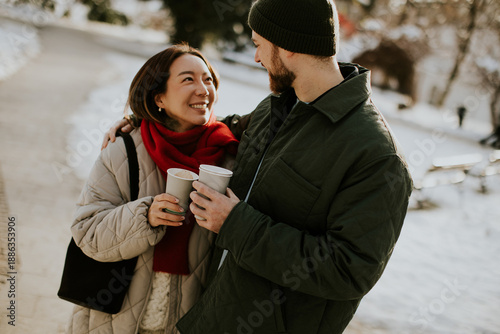 Loving couple holding coffe...