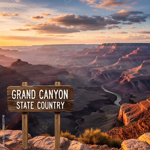 Massive geological chasm viewable from a rocky precipice at sunset with an informational wooden marker