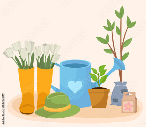 Spring composition elements plants watering can seeds pack hat rubber boots tulips flowers