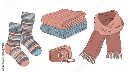 Cozy winter accessories set includes a pair of striped socks, folded blankets, a vintage camera, and a warm brown scarf.