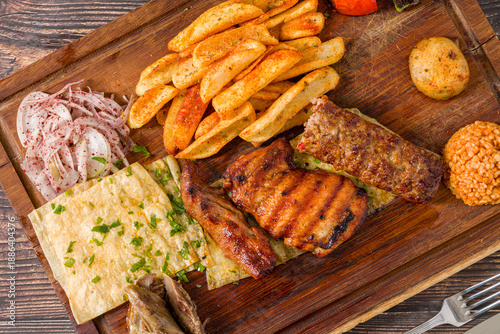 Fotografi Traditional Turkish mixed grill platter served on wooden board