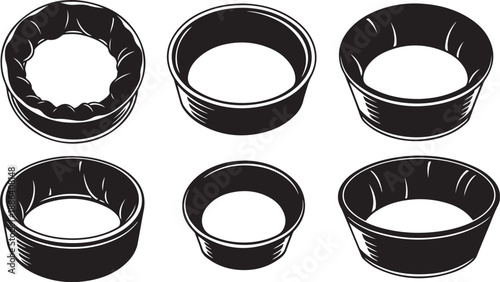 Collection of empty black baking molds on white background