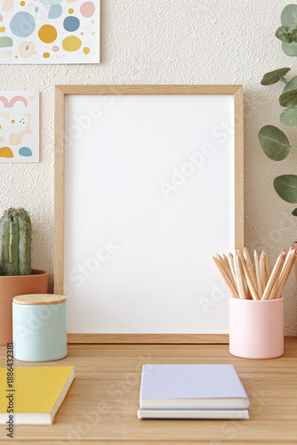 Vertical wooden frame mockup for kids wall decor, blank frame in minimalist children’s room, soft daylight, clean commercial stock photo with single focal point.
