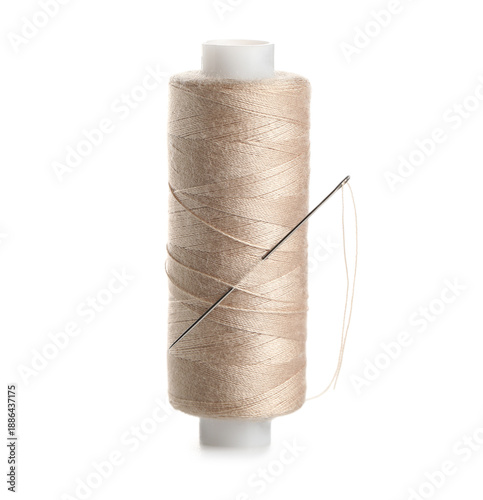Beige sewing thread with ne...