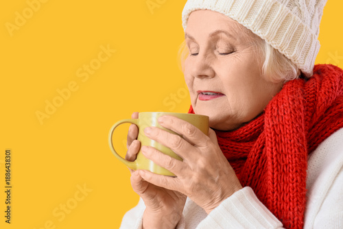 Sick elderly woman with cup...