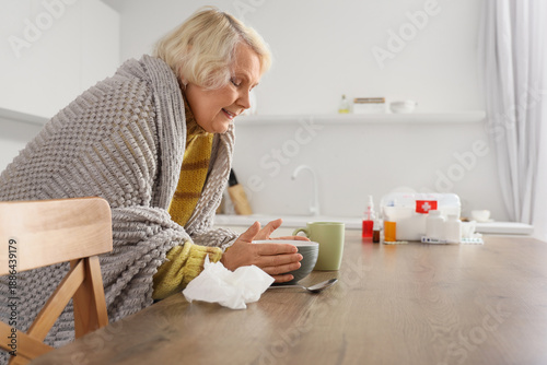 Sick elderly woman with bow...