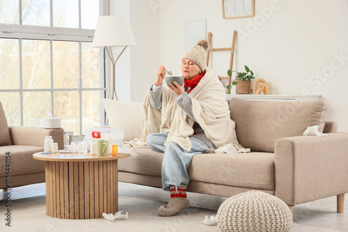 Sick elderly woman eating s...