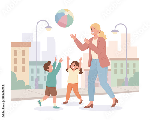 Mother and kids playing with beach ball in city