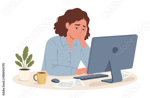 Woman frustrated at computer with documents
