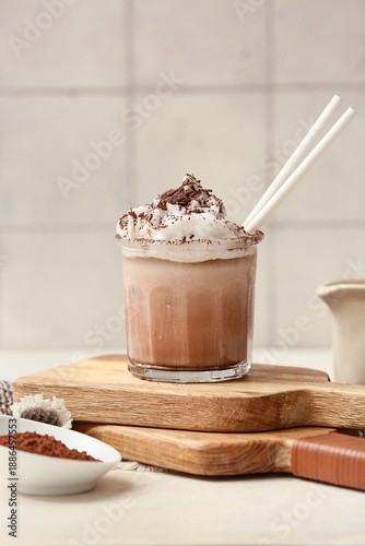 Glass of cold cocoa drink w...