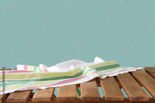 Napkin on wooden table agai...