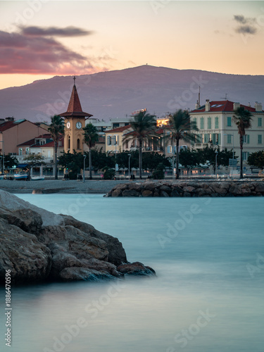 Purple twilight clouds over the St Pierre Chapel and Mediterranean sea in Cros-de-Cagnes.