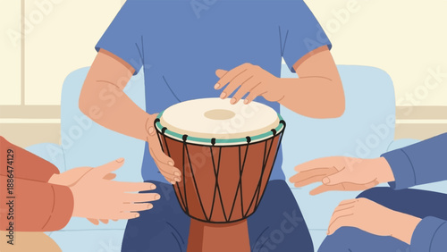 People gathered around a drum on a couch, hands playing