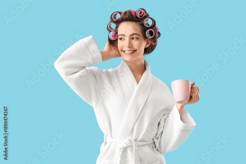 Young woman in bathrobe wit...