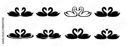 White swans glowing among shadows in symmetrical pattern