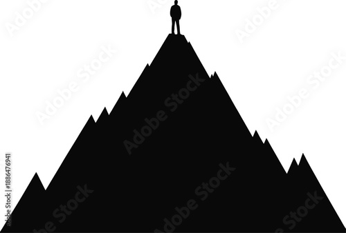 Man Standing On Top Of Mountain Peak