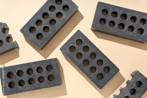Black bricks on beige backg...