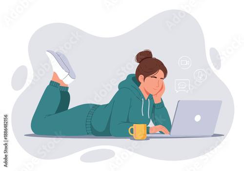 Relaxed young woman working or studying remotely on laptop at home