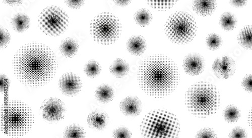 A seamless pattern of fuzzy black and white circular shapes of varying sizes.