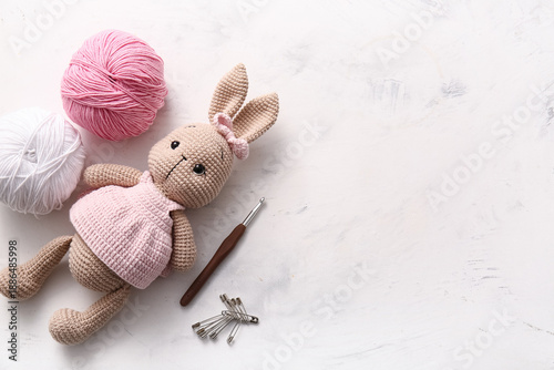 Knitted bunny toy with yarn...