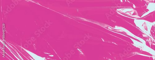 Vibrant pink background with a glossy, plastic-like texture. The pink background features reflective, crinkled patterns. Plastic foil wrap texture background. Pink background vector.